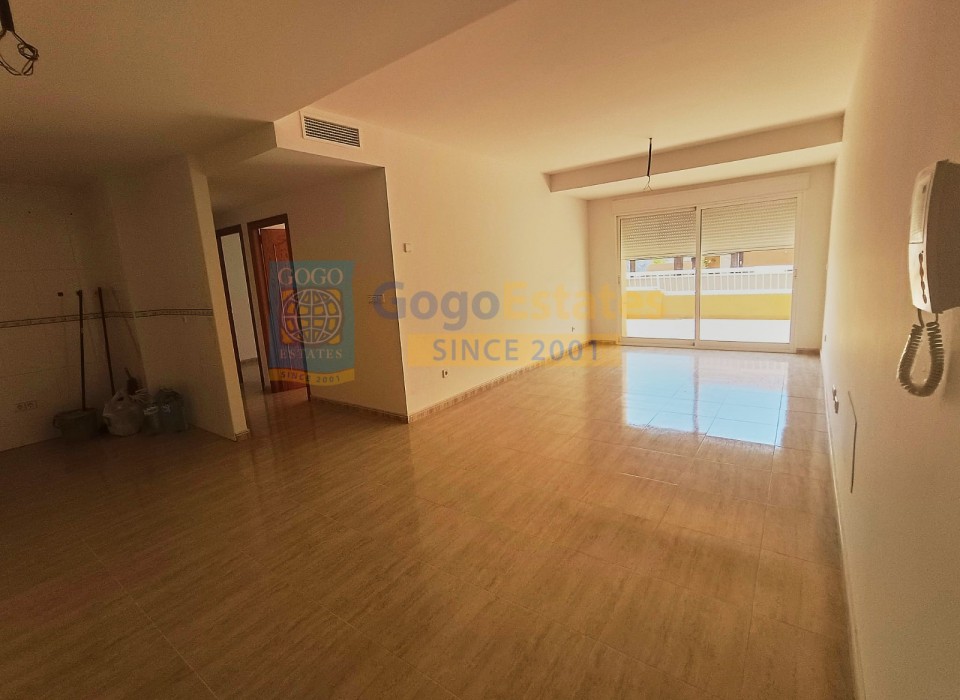 Spacious living room with glass door, good light entry